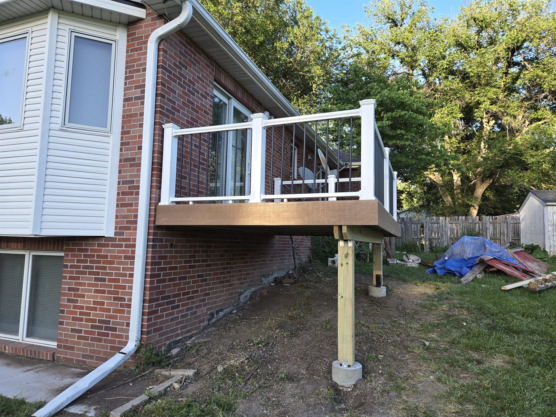 Elevated deck addition on a brick residential home