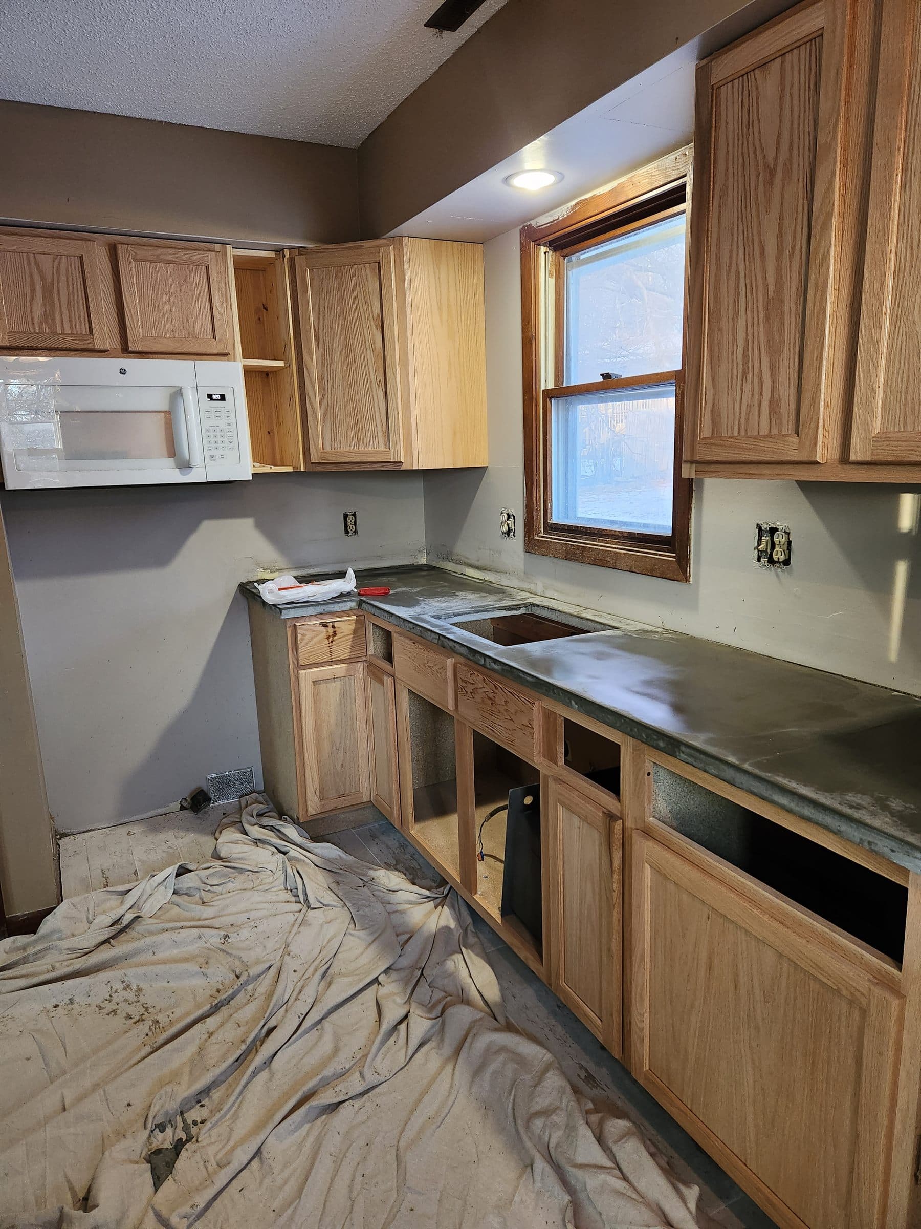 Kitchen remodeling work in progress with cabinets and counters